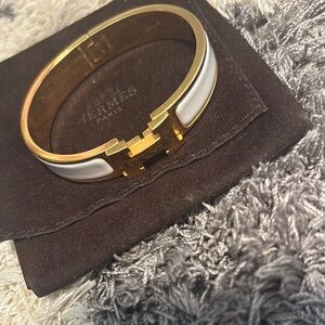 Hermès Gold and White Clic Clac Bracelet